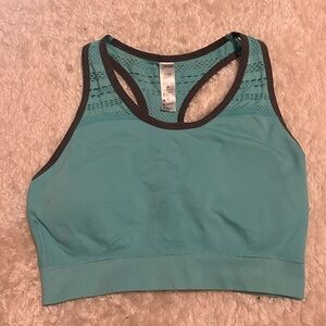Teal sports bra with removable pads. Size: adult small